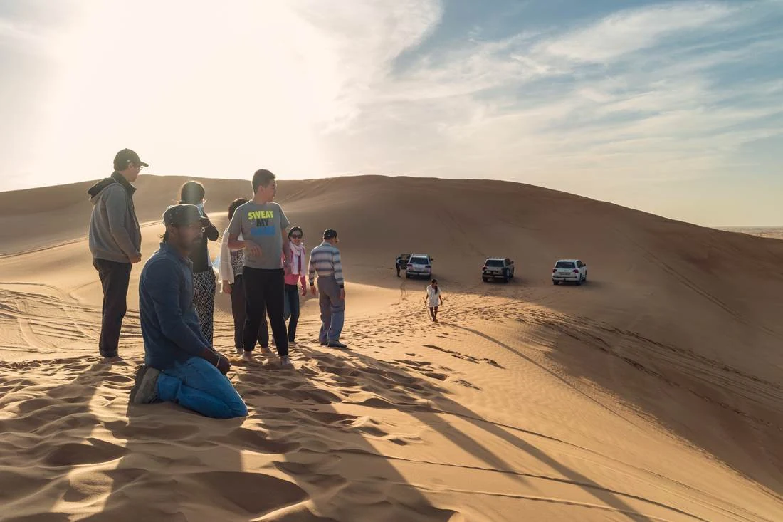UAE flags over a Bedouin-style camp in the Liwa desert